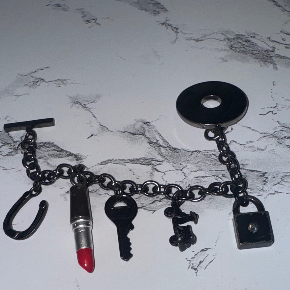 Mac Cosmetics old school charm bracelet 
Does have signs of wear
